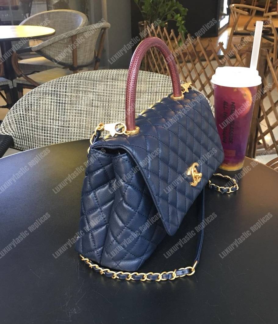 Ch*el flap bag with top handle navy blue