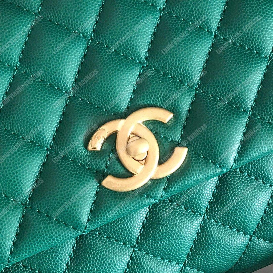 Ch*el flap bag with top handle green