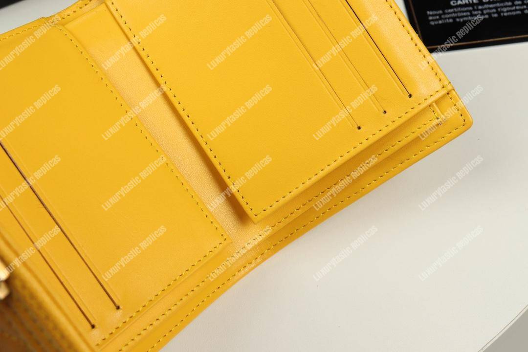 Ch*el boy small flap wallet yellow
