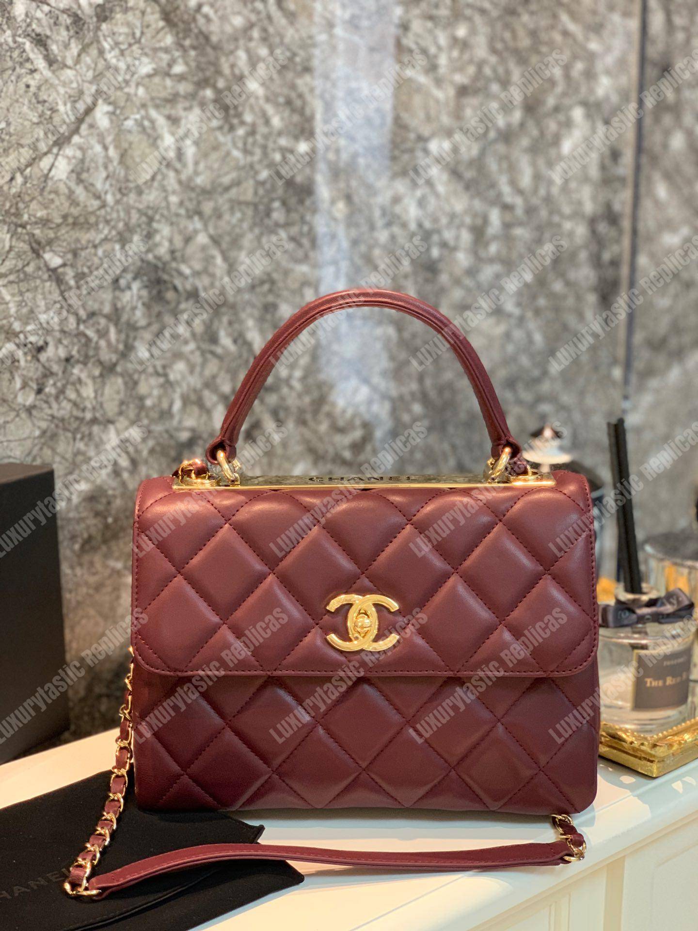 Ch*el small flap bag with top handle burgundy-gold
