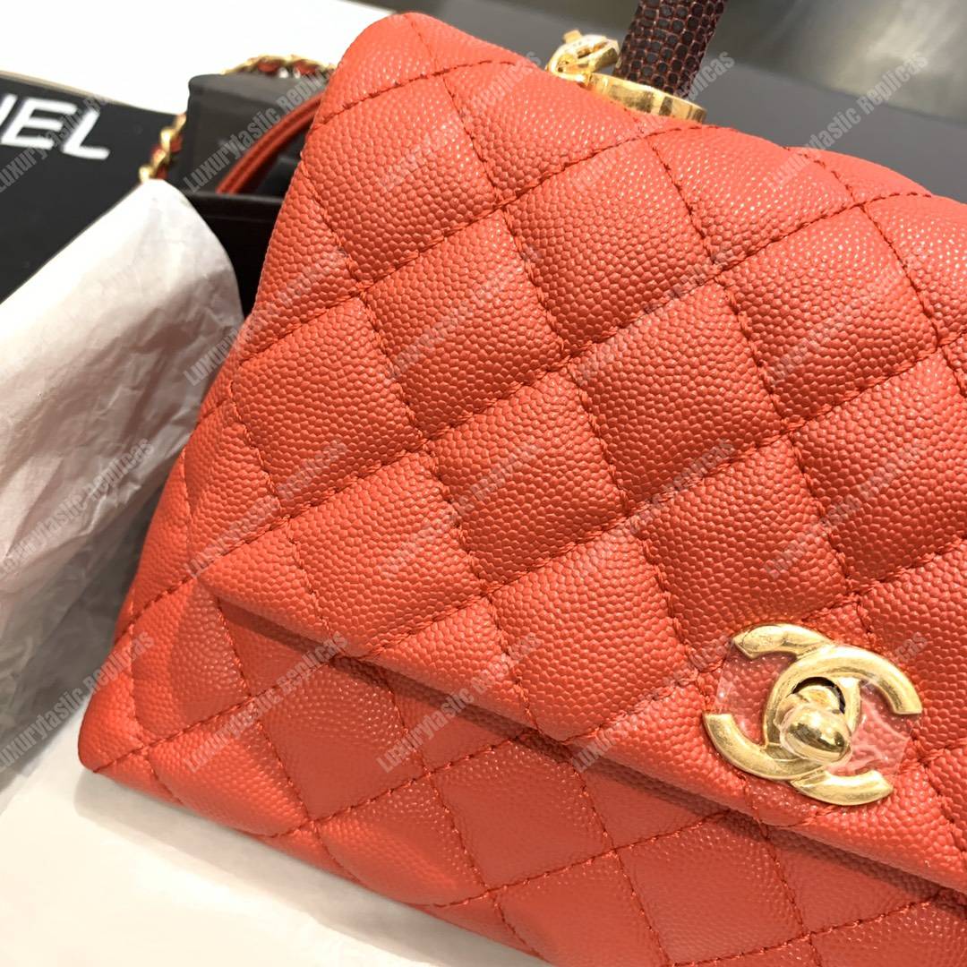 Ch*el flap bag with top handle orange