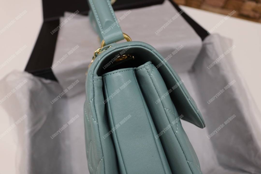 Ch*el small flap bag with top handle light blue-gold