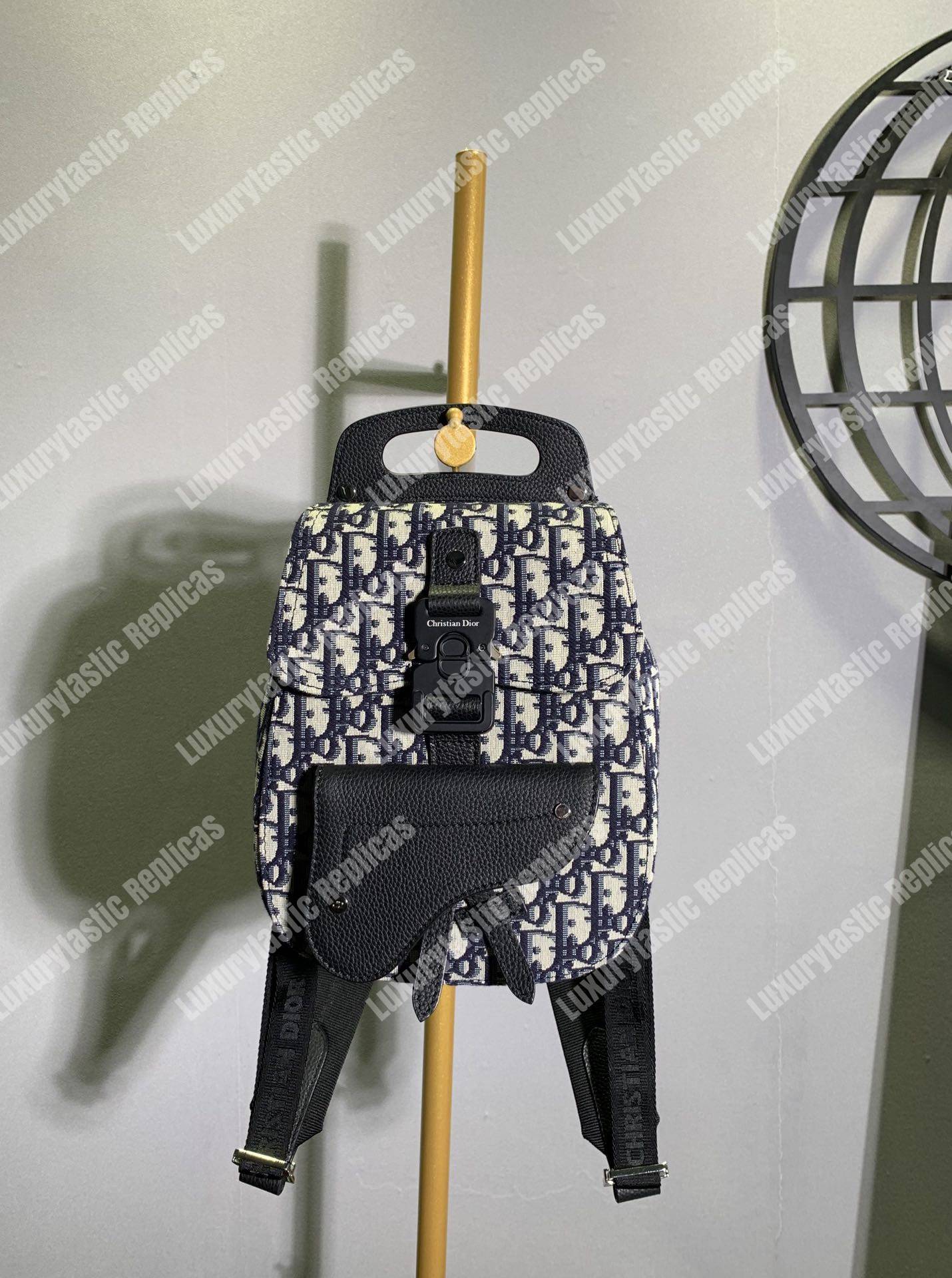 D*or navy blue oblique jacquard mini saddle backpack
