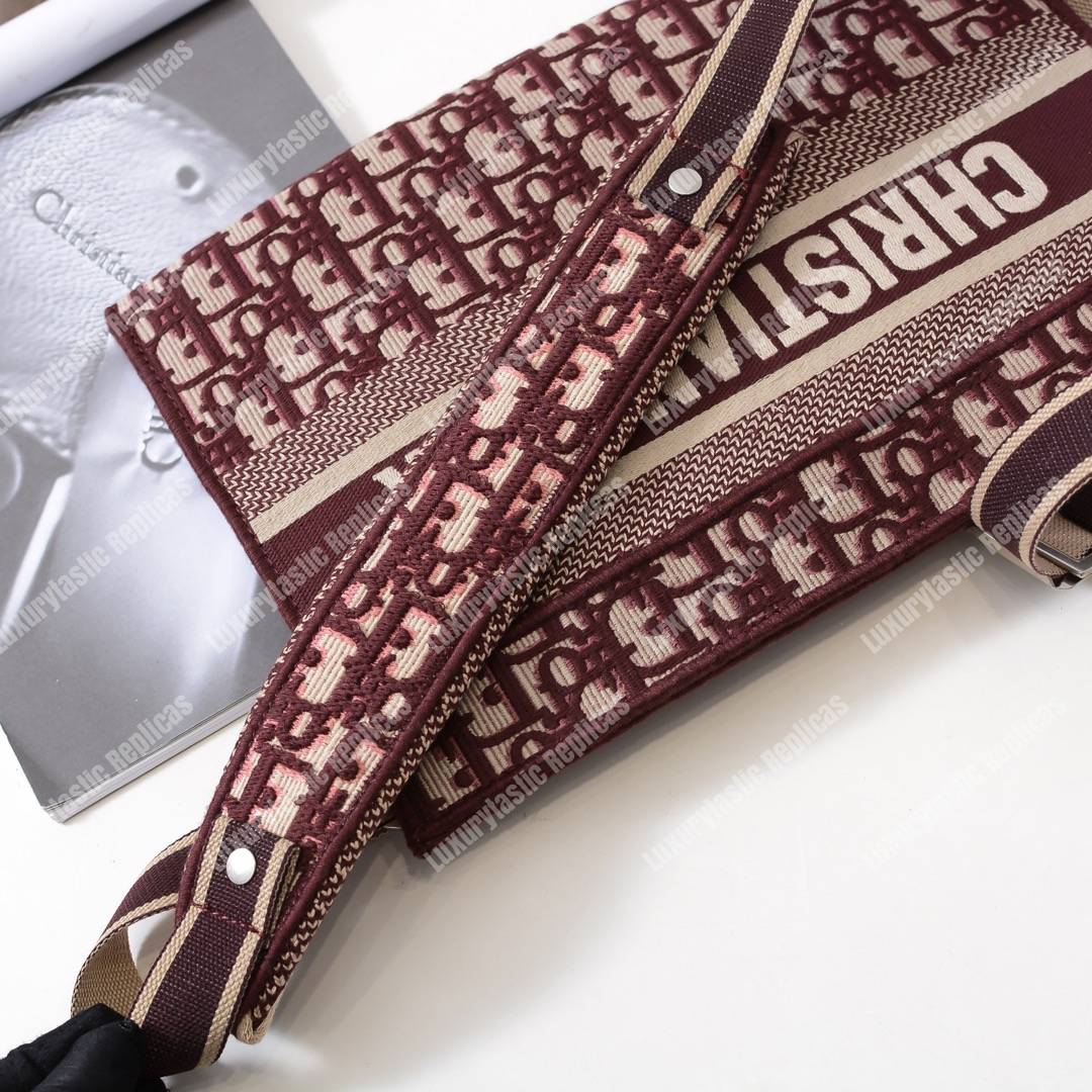 D*or burgundy oblique embroidered canvas clutch