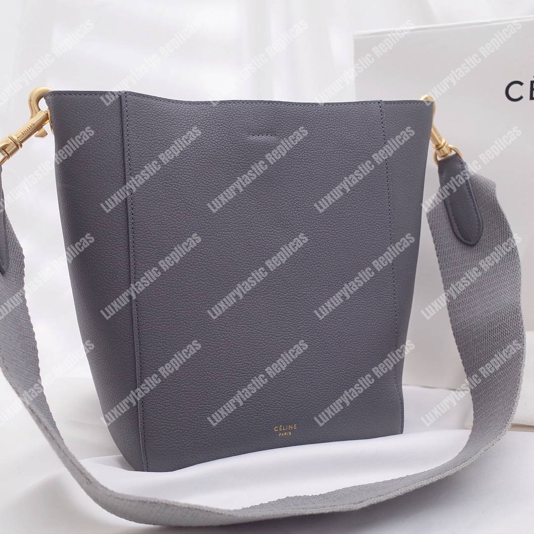 Ce**e sangle small bucket bag in soft grained calfskin grey