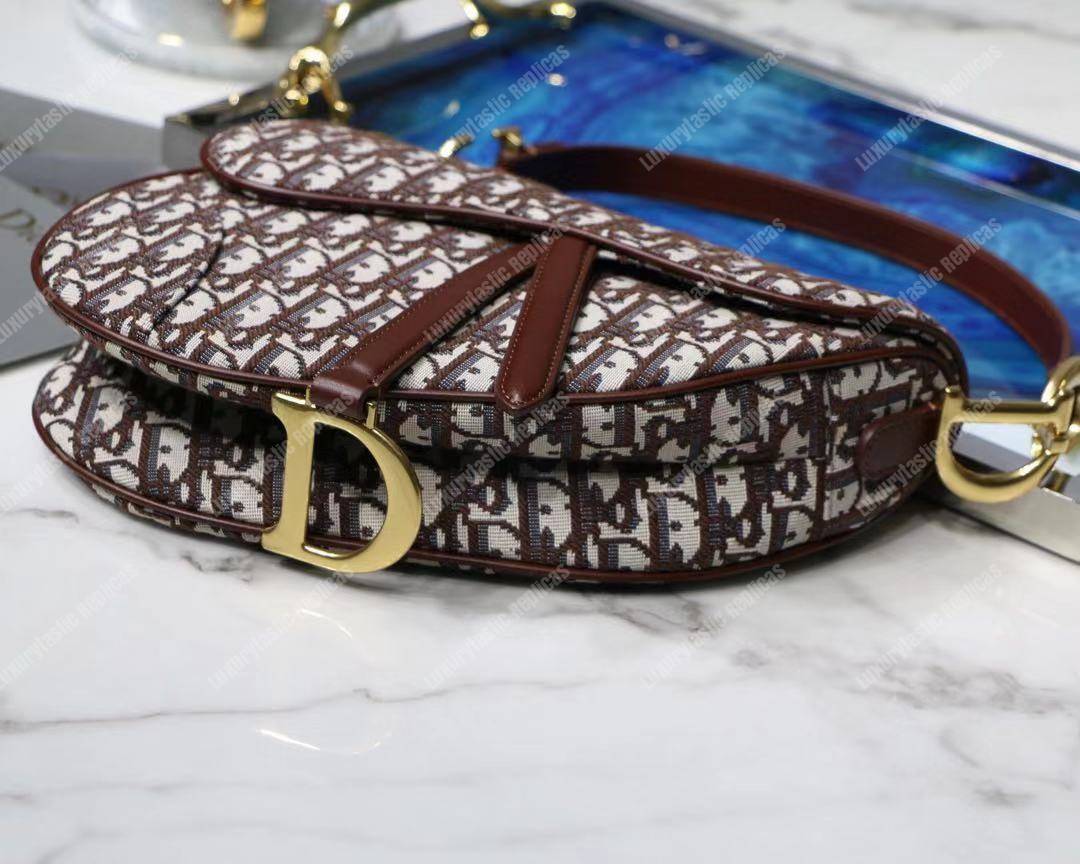 D*or burgundy oblique saddle bag