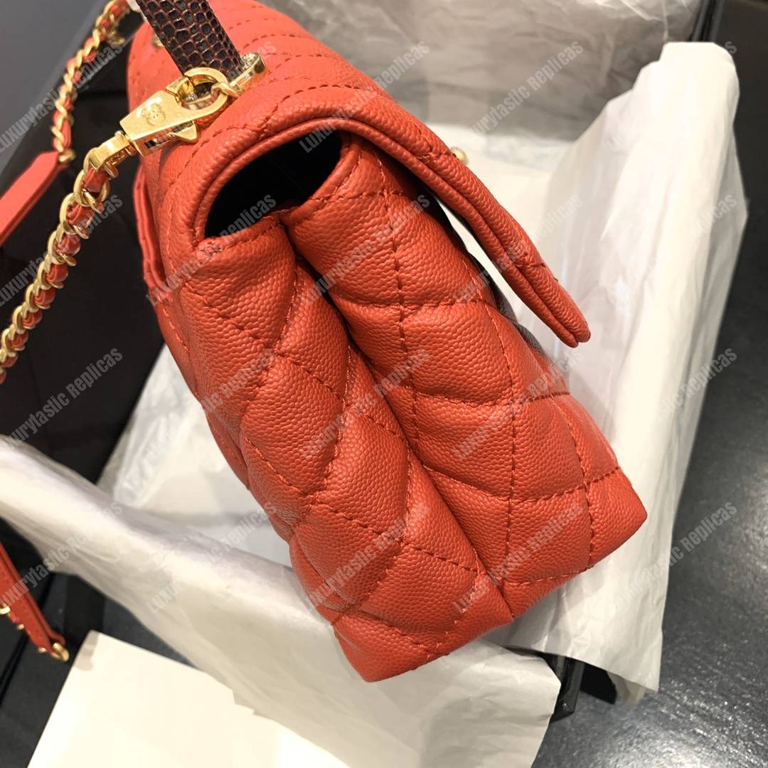 Ch*el flap bag with top handle orange