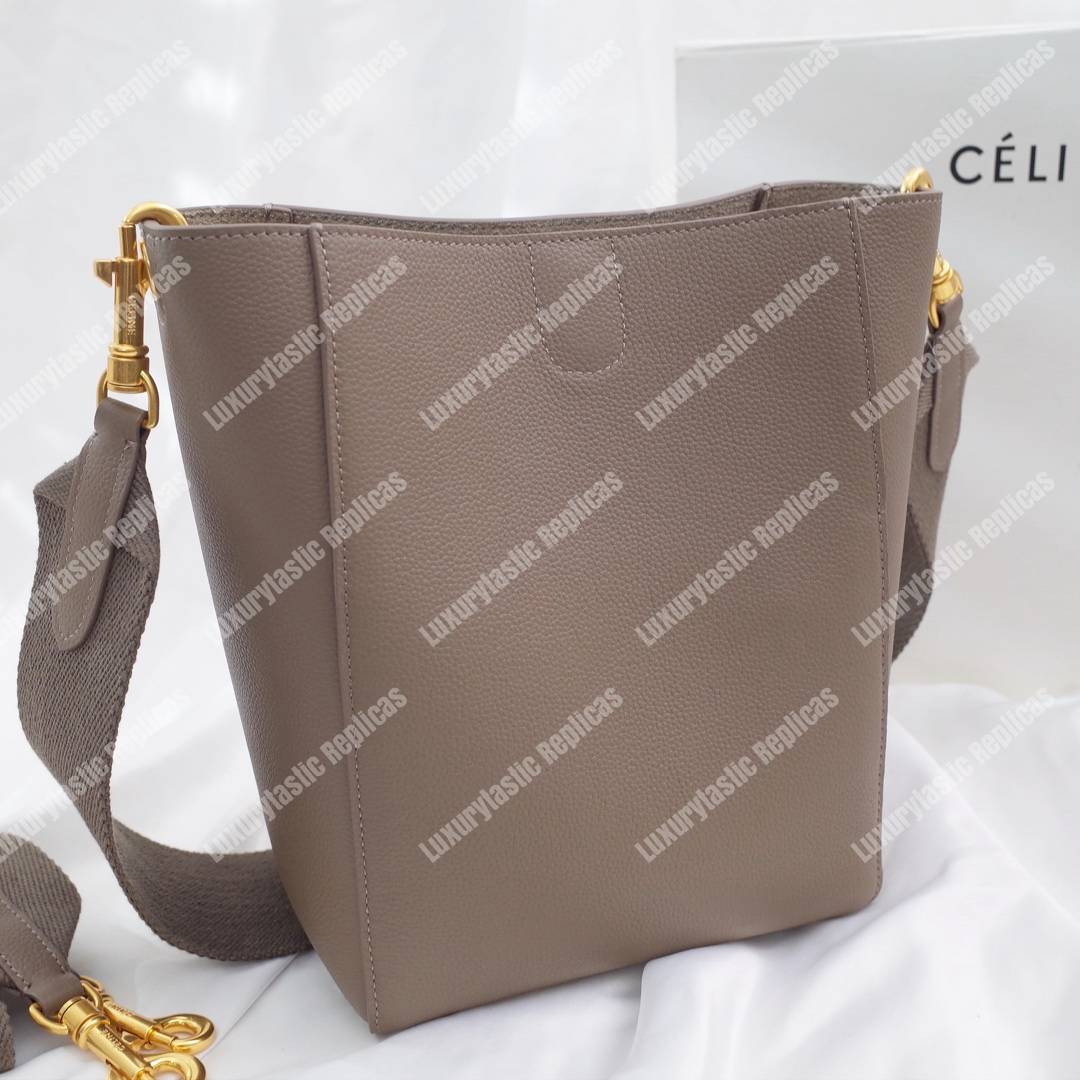 Ce**e sangle small bucket bag in soft grained calfskin taupe