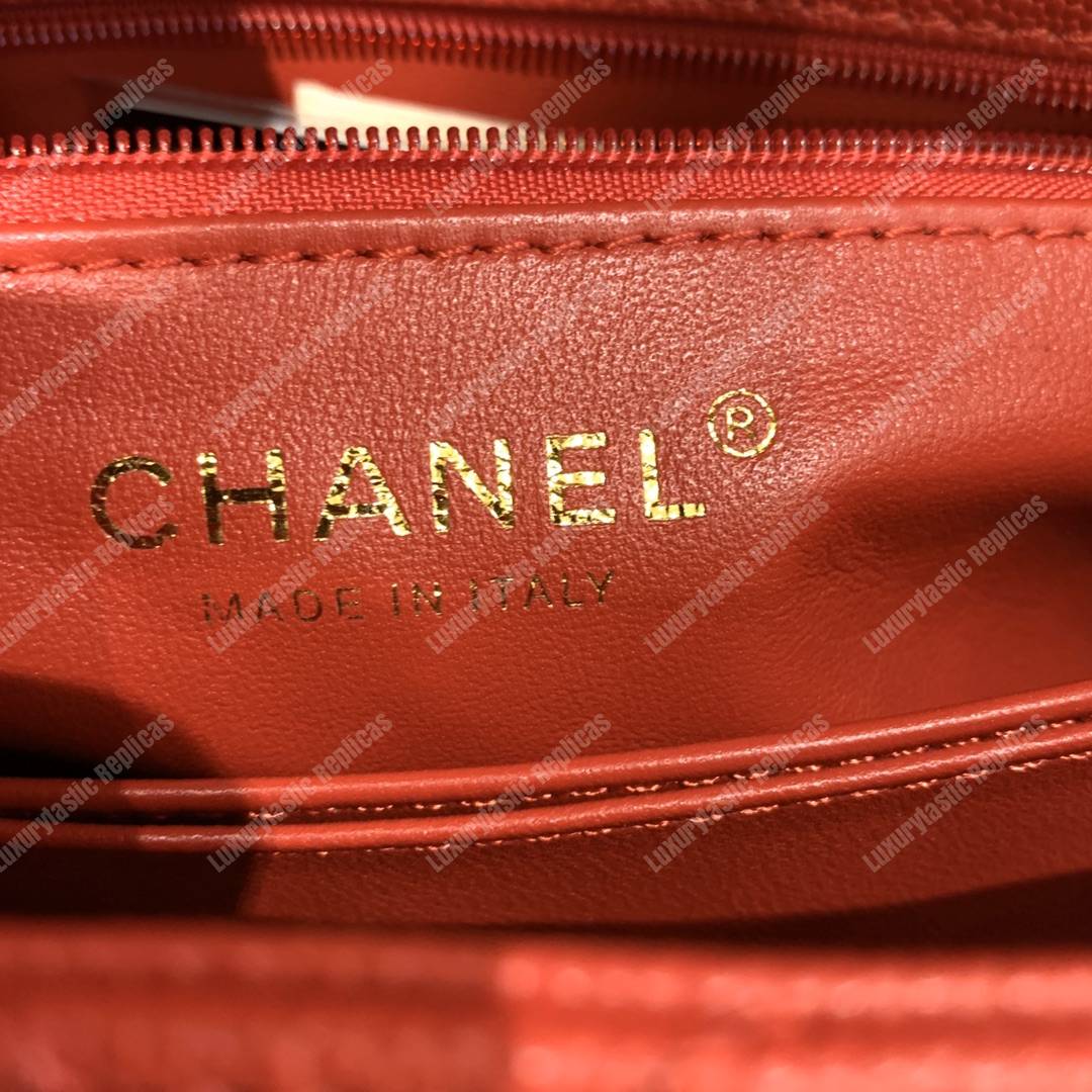 Ch*el flap bag with top handle orange
