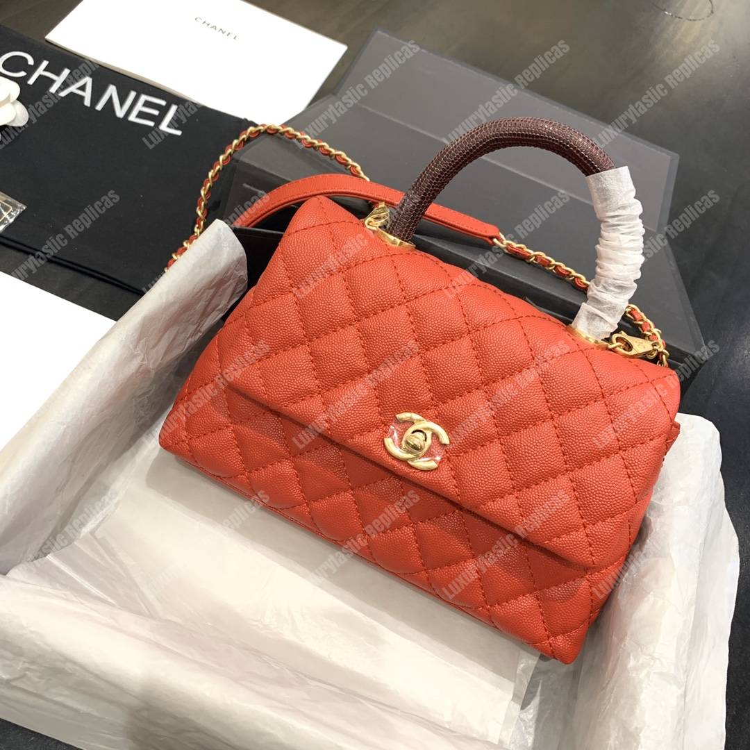 Ch*el flap bag with top handle orange