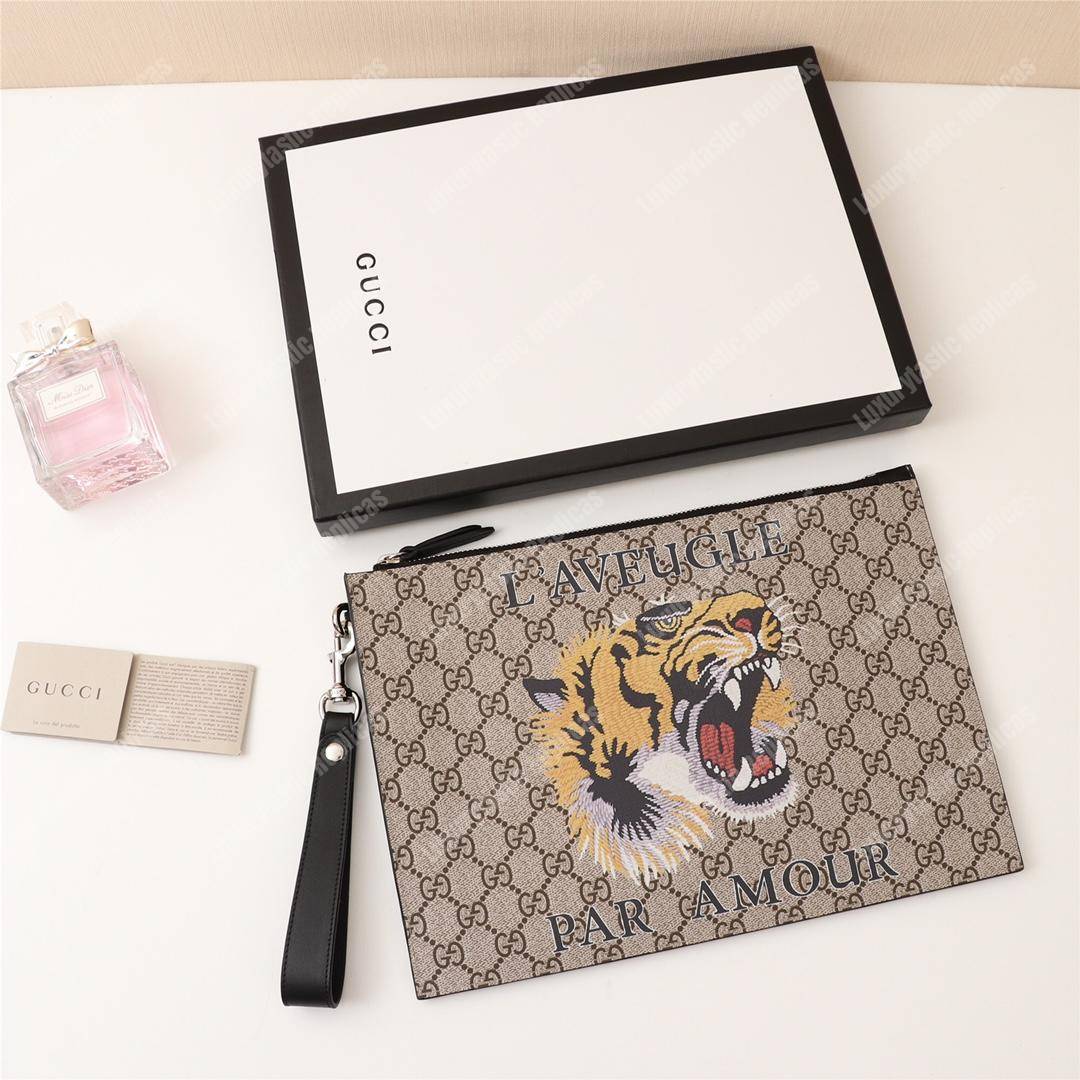 G*u*i tiger print gg sup*e clutch pouch