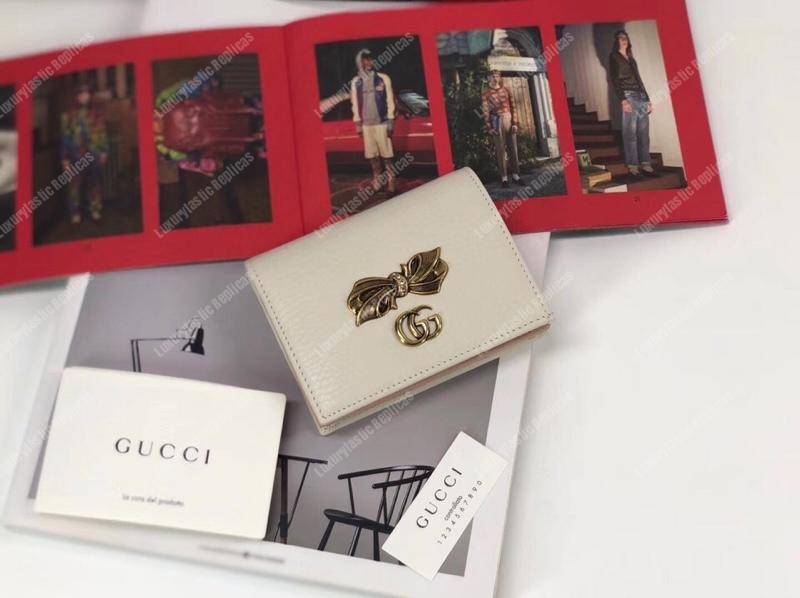 G*u*i leather zip wallet with bow white