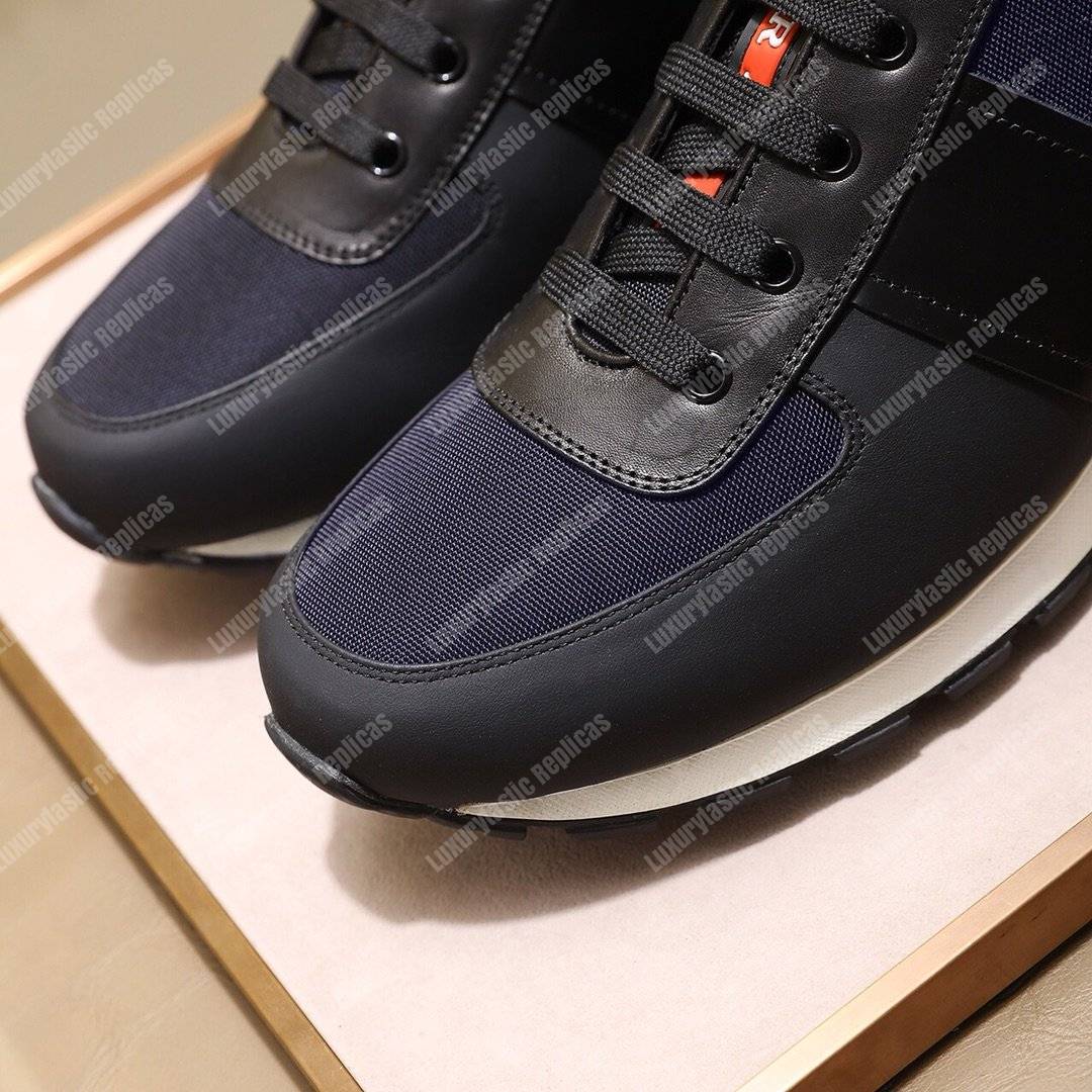 Pra*a fabric and leather sneakers blue/black/orange