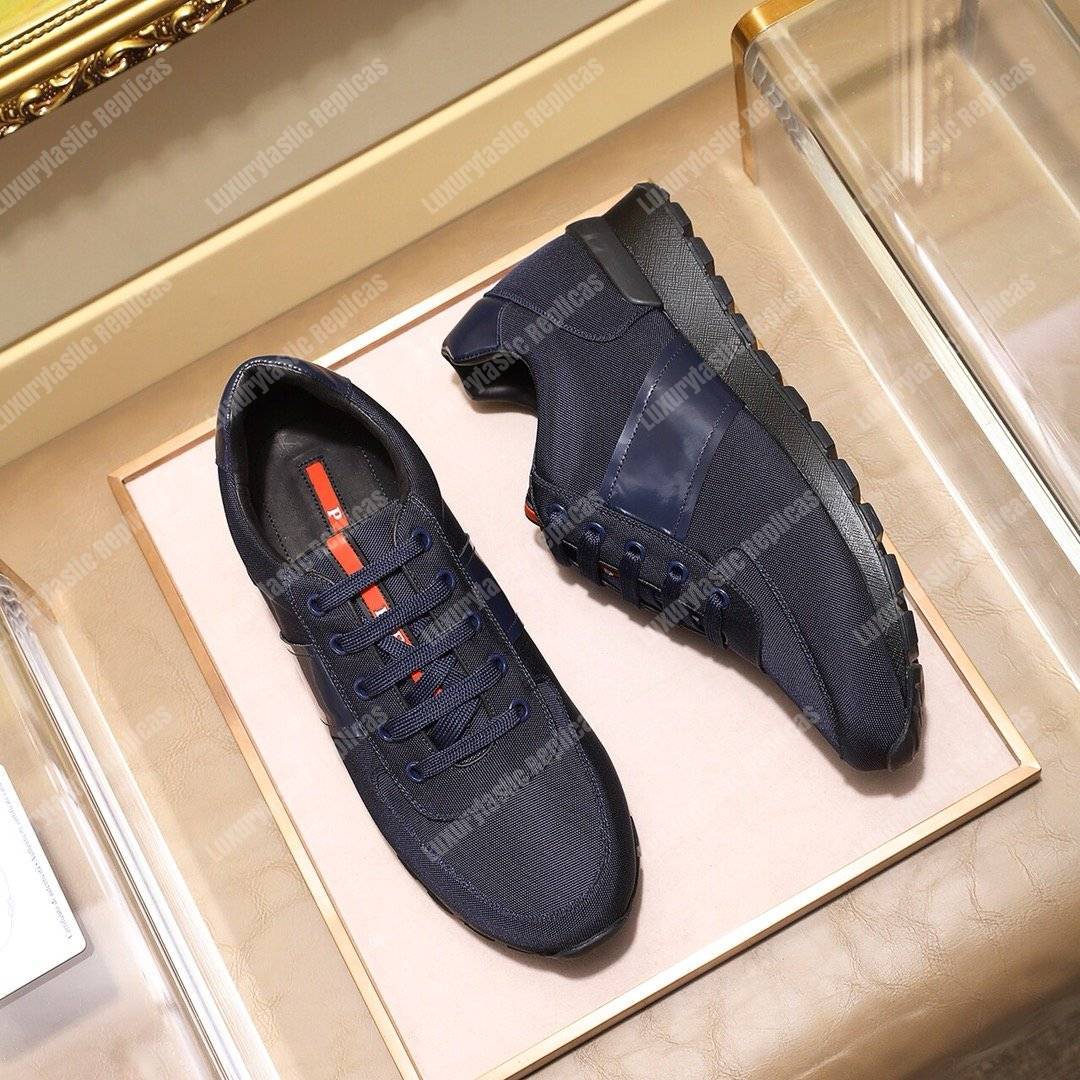 Pra*a fabric and leather sneakers dark blue