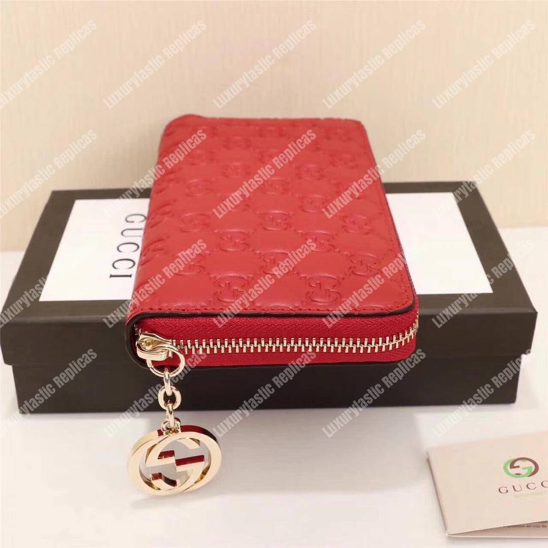 G*u*i icon G*u*i signature zip around wallet hibiscus red