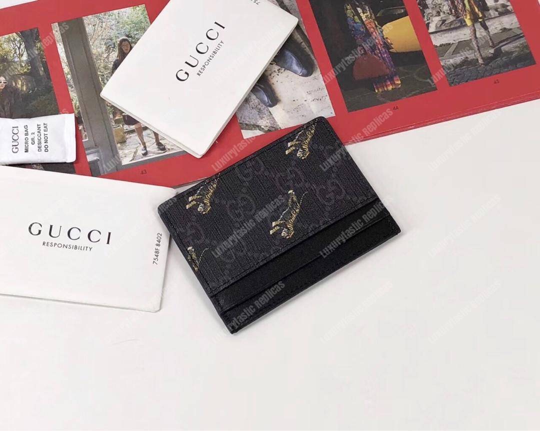 G*u*i gg card case with tiger print