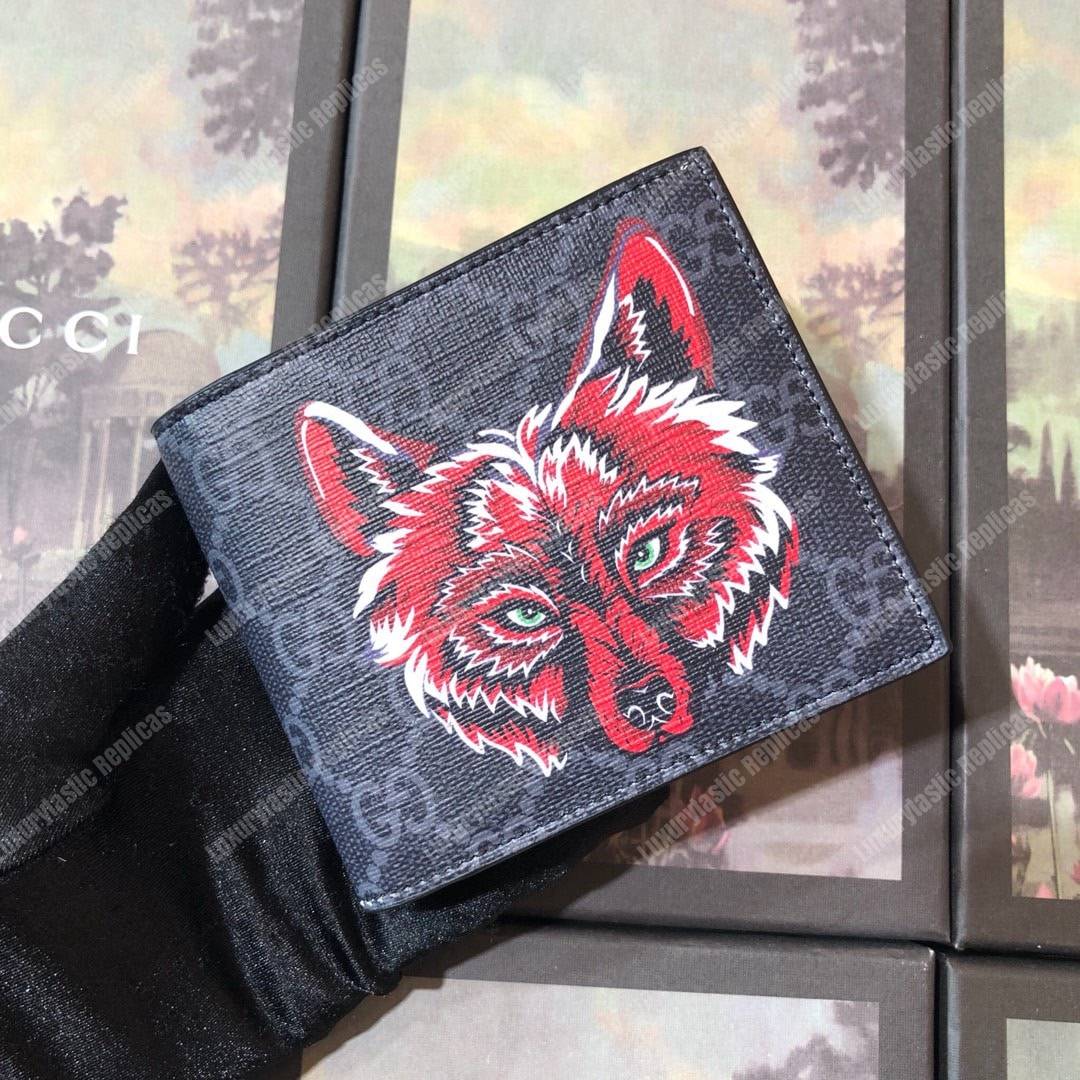 G*u*i gg sup*e wallet with wolf