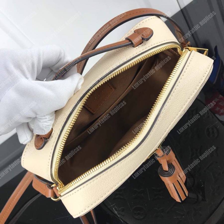 LV Saintonge Monogram Empreinte Leather Creme Caramel