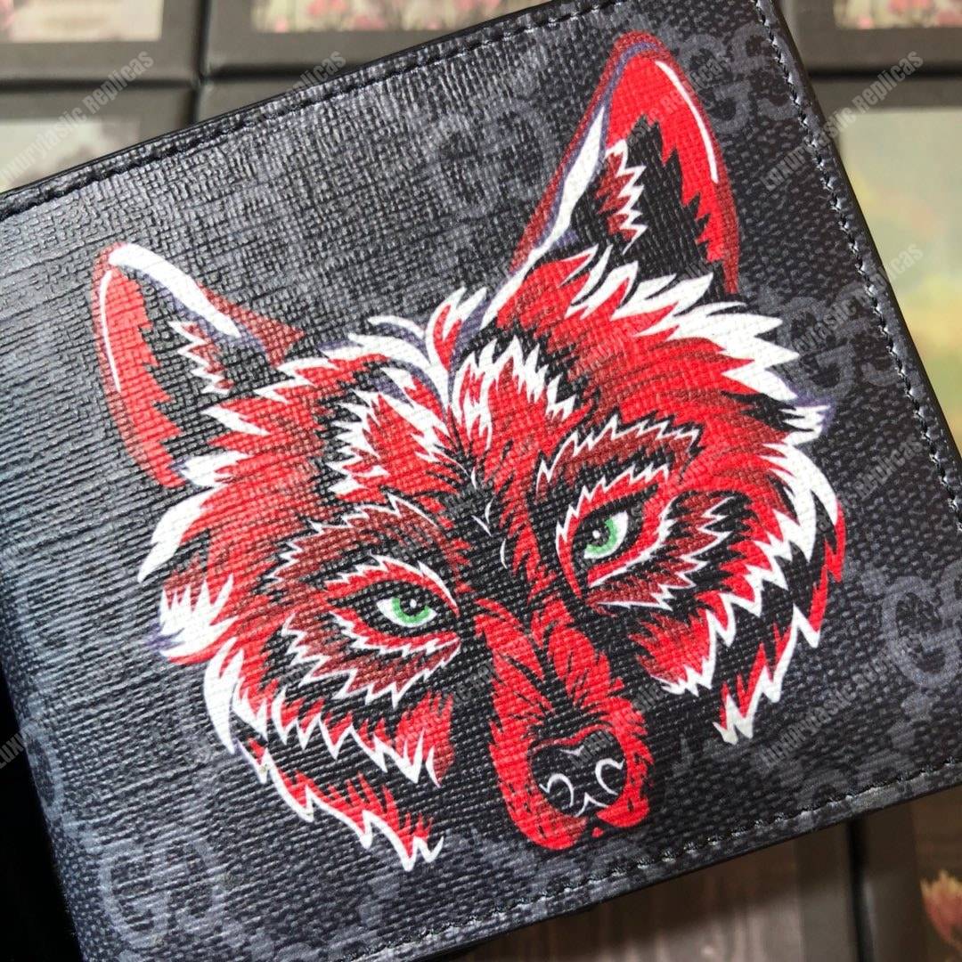 G*u*i gg sup*e wallet with wolf