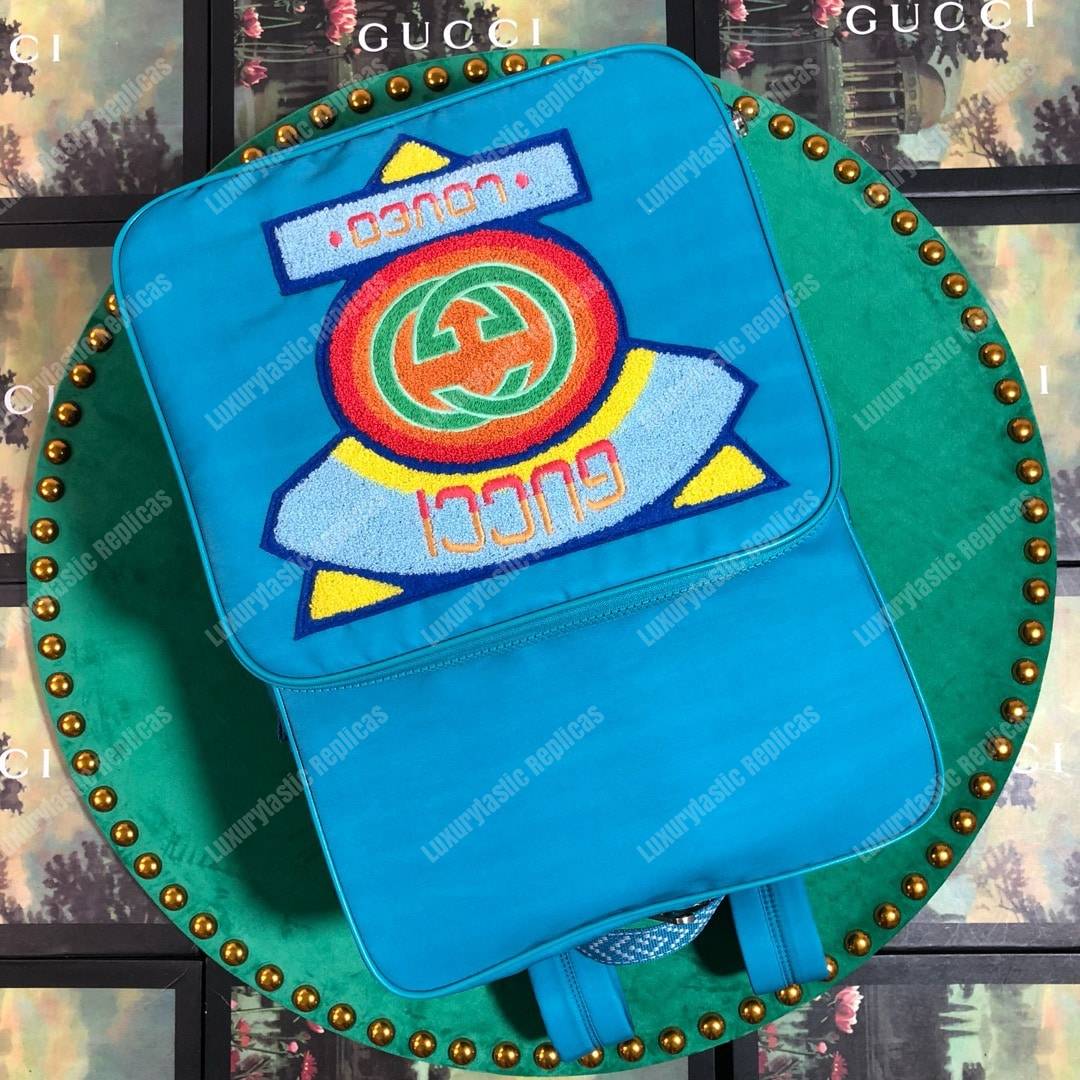 G*u*i medium backpack with G*u*i ’80s patch light blue