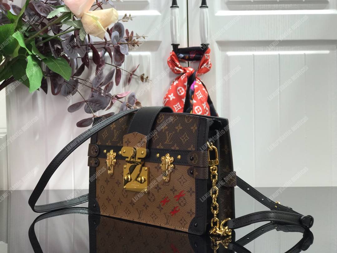 LV Trunk Clutch Monogram Reverse Canvas