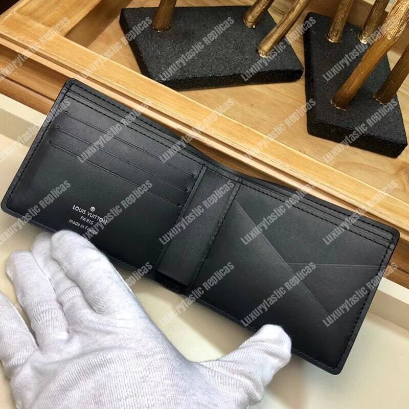 LV Multiple Wallet Taurillon Leather Blue Initials