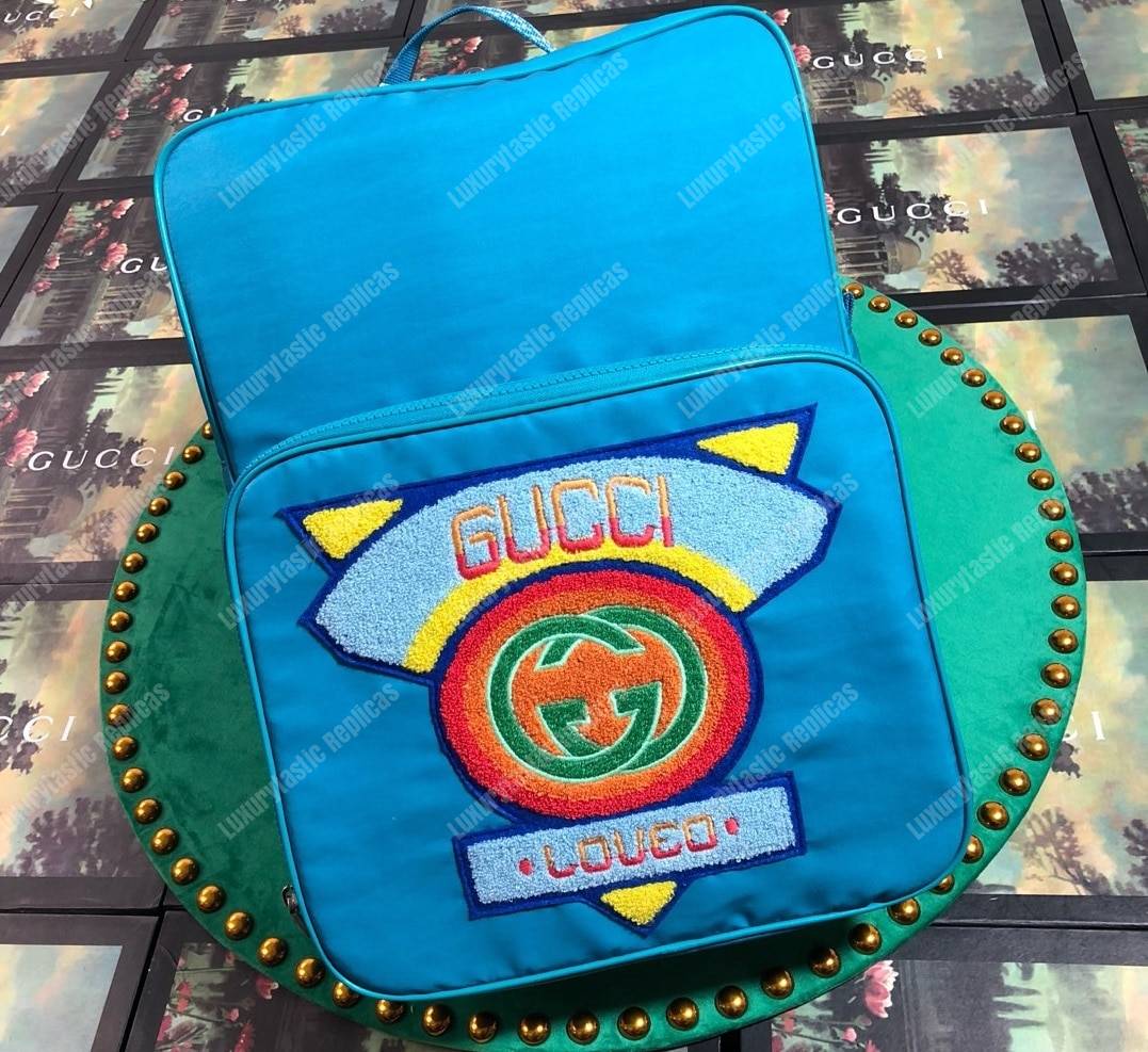 G*u*i medium backpack with G*u*i ’80s patch light blue