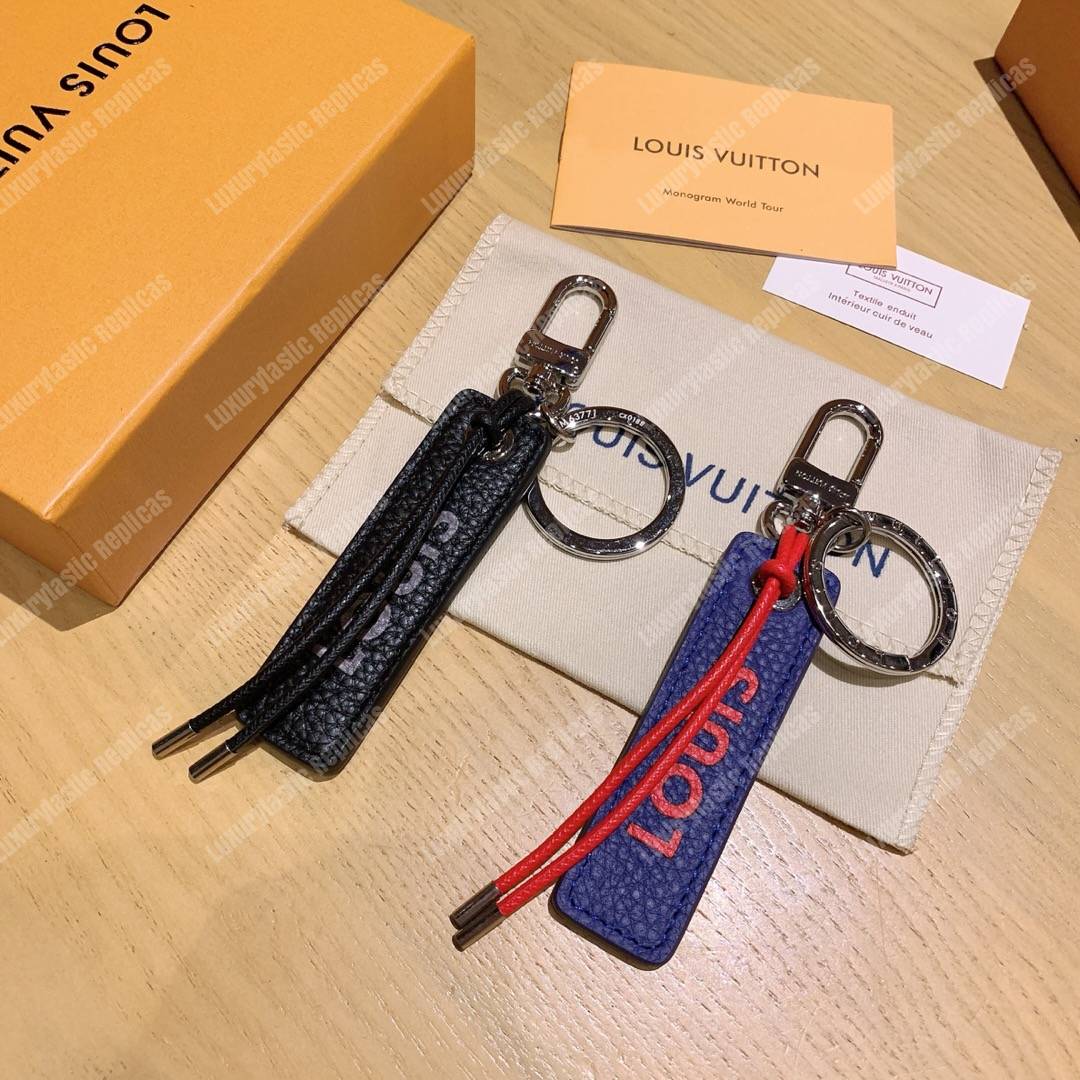 lv tab l**is V*t*n bag charm and key holder
