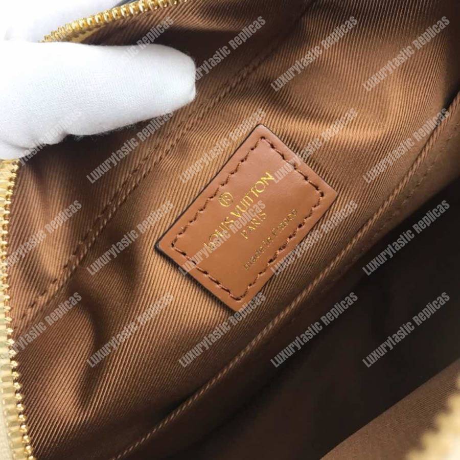 LV Saintonge Monogram Empreinte Leather Creme Caramel