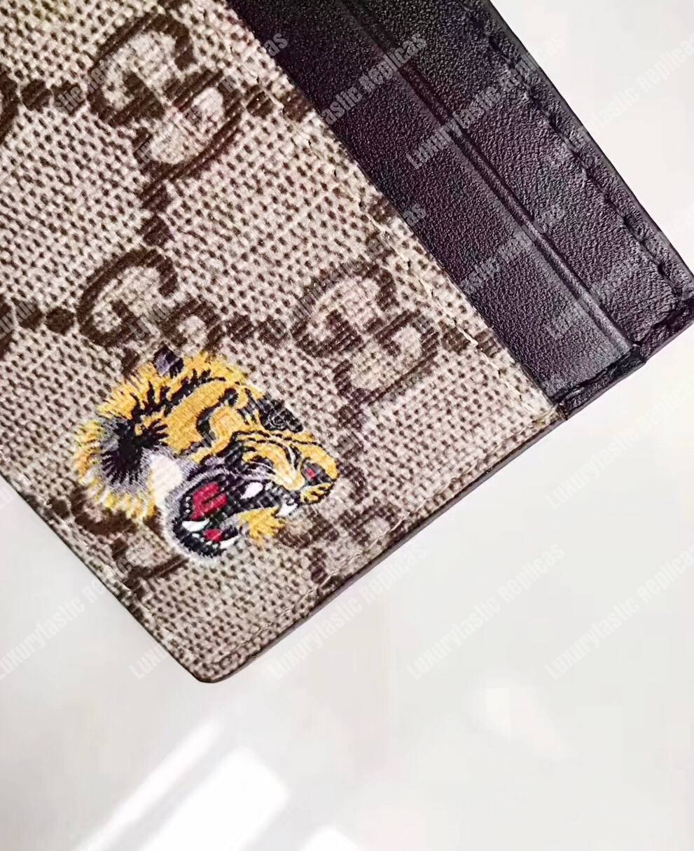 G*u*i tiger print gg sup*e card case