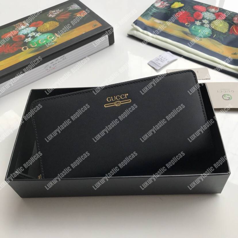 G*u*i leather zip around wallet with G*u*i logo