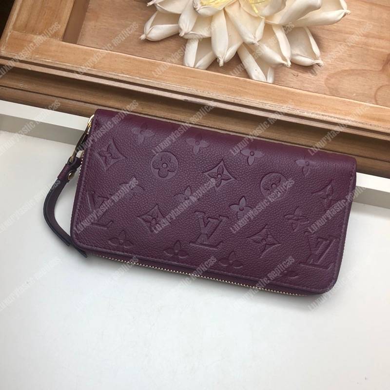 LV Clémence Wallet Monogram Empreinte Leather Raisin