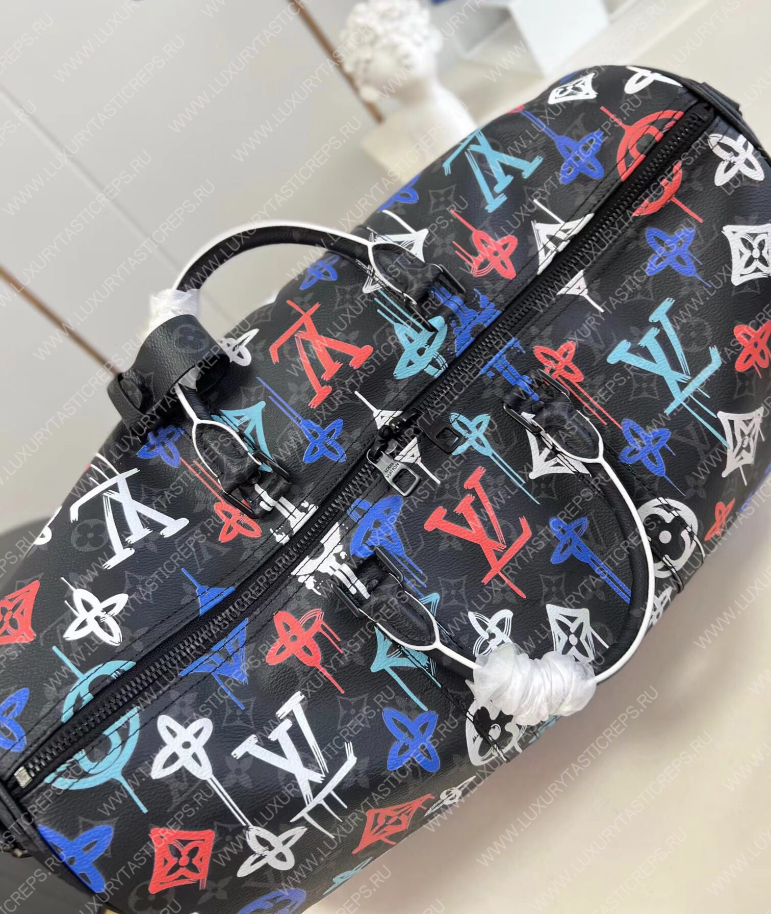 KEEPALL BANDOULIÈRE 50 GRAFFITI ORANGE