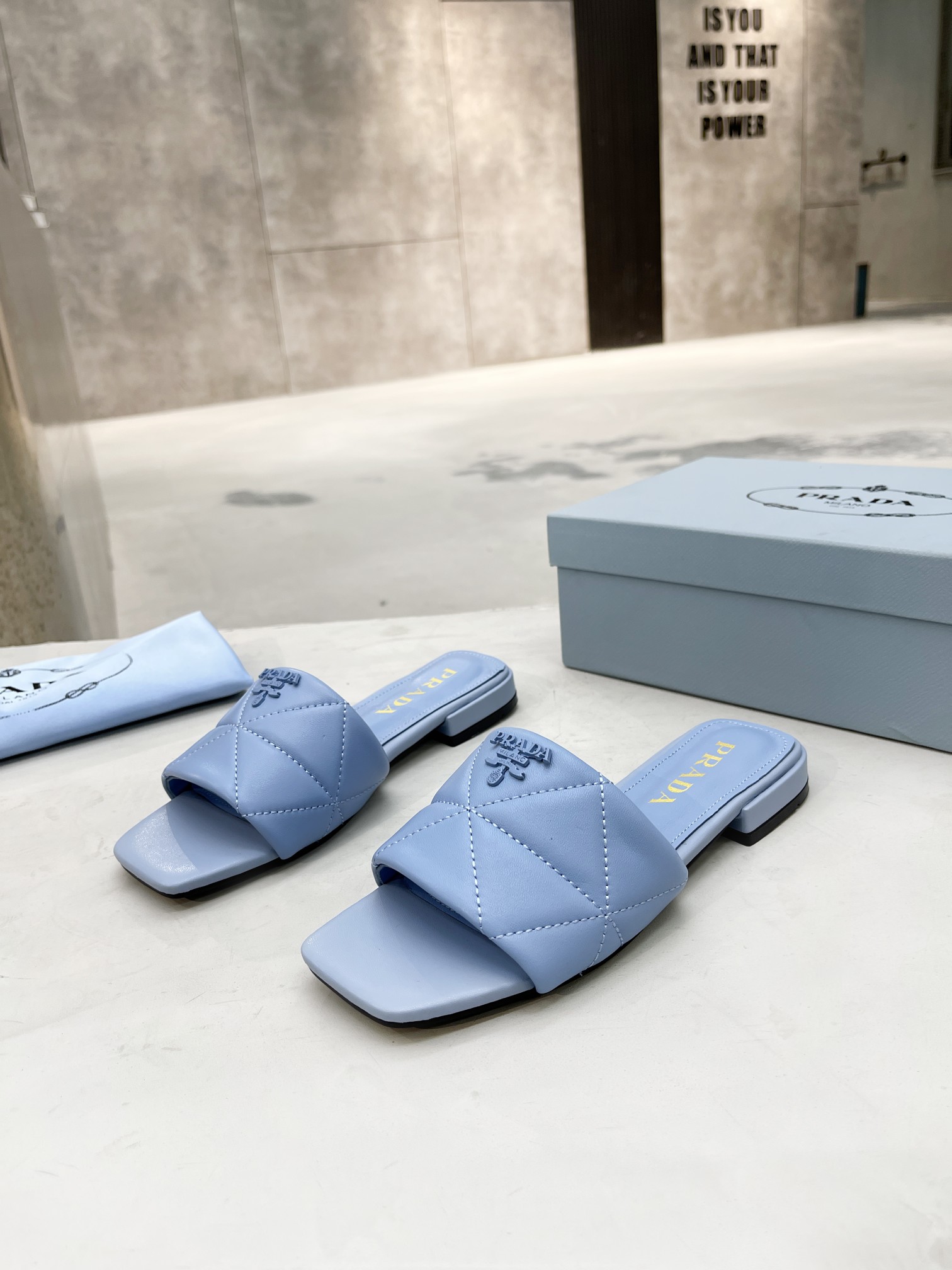 Pra*a quilted nappa leather sabots light blue 1xx583